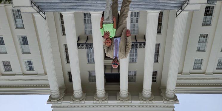 DA Jeremy Duerr and his son Stephen. on the steps of the state capitol.