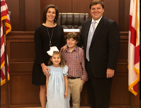 Andrew Hamlin poses with his wife and two children.